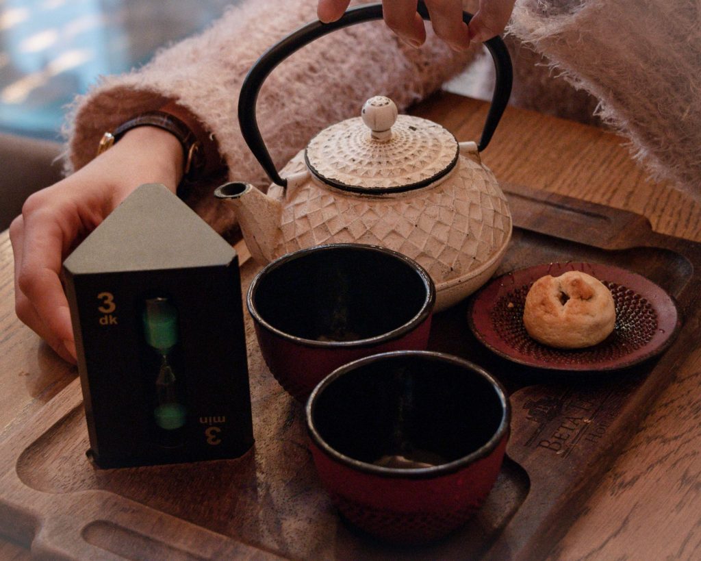 A teapot and two cups.