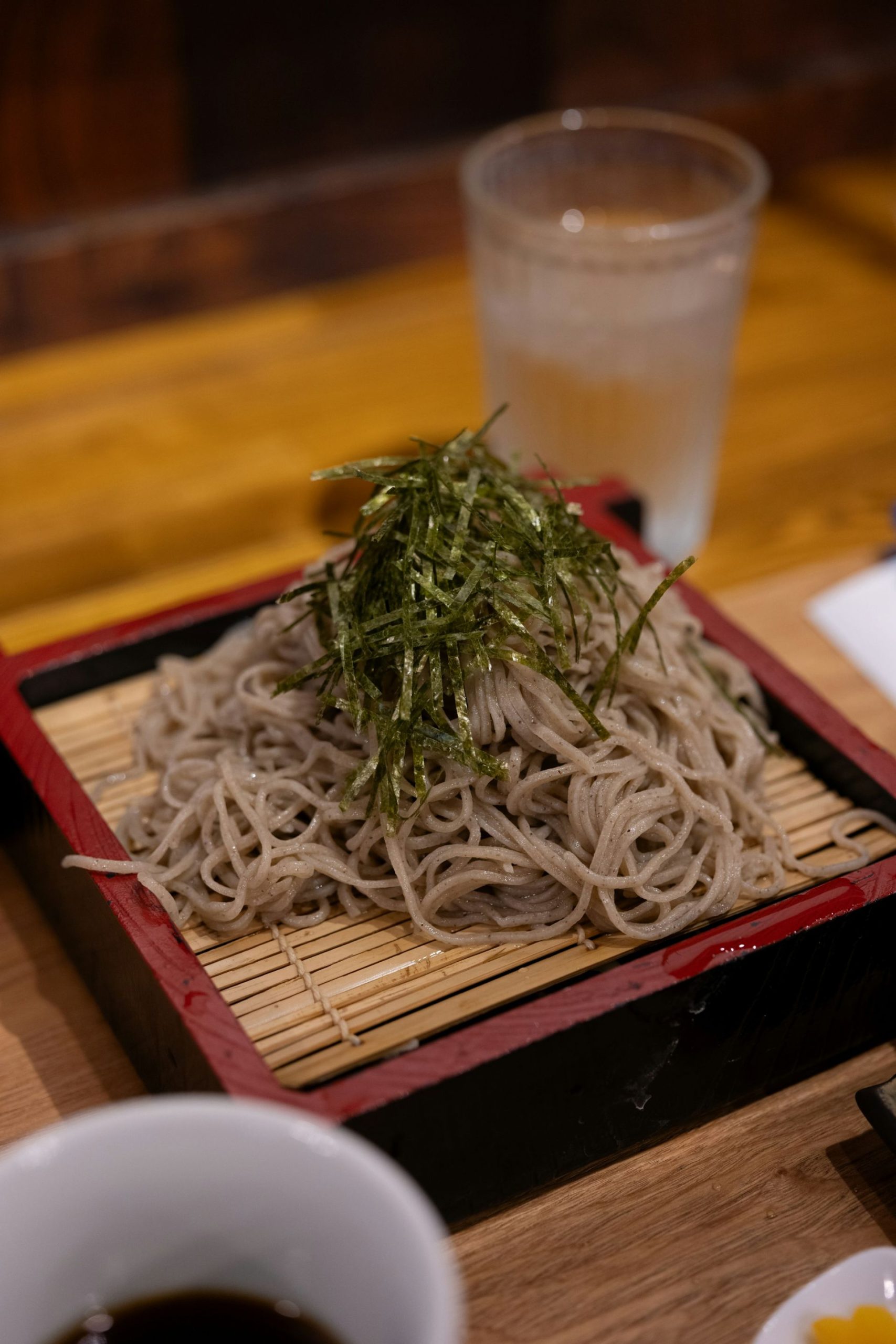 Cold soba on a square tray.